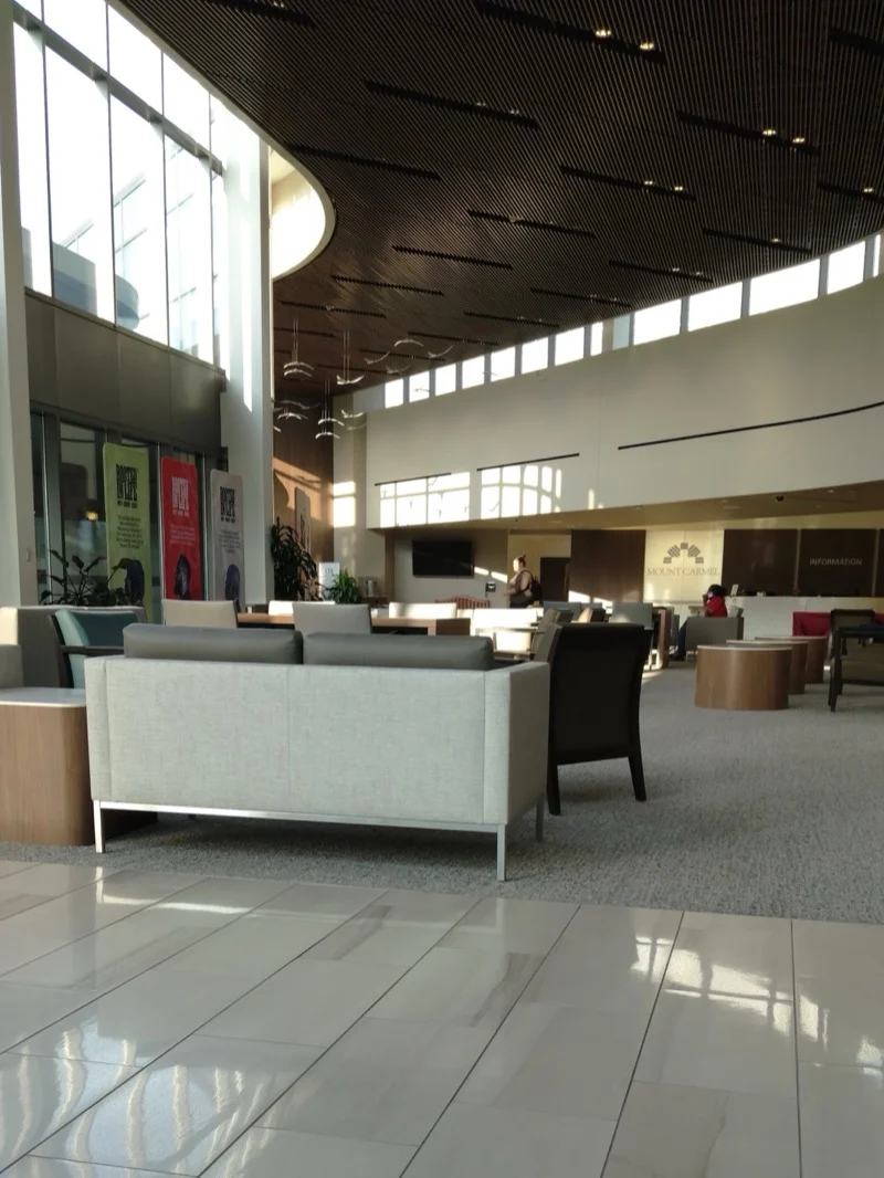 Grand office lobby with gleaming polished tile floor after Maloon cleaning